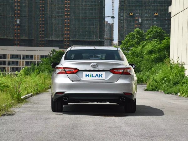 Rear view of a silver Toyota CAMRY 2.5Q electric car.