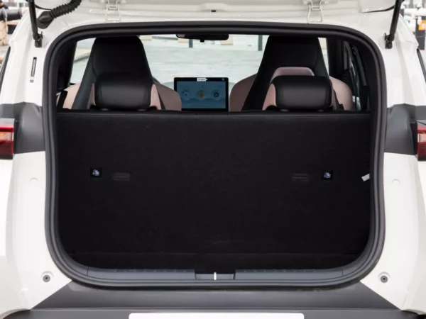 Detailed view of the trunk of a white BYD Seagull electric car with the trunk door open and black trim inside.