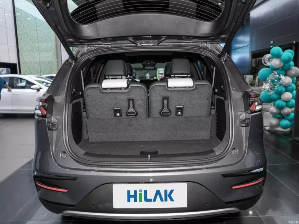 A close-up picture of a gray BYD Tang electric car with the trunk open and plenty of room.