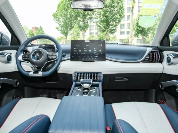 Detailed image of the interior cab trim of the BYD Yuan Plus electric car vehicle, trim colors are grey and blue with red line trim.