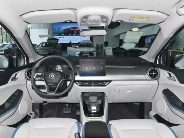 A detailed view of the interior of the cab of a BYD Yuan Pro electric car with white trim.